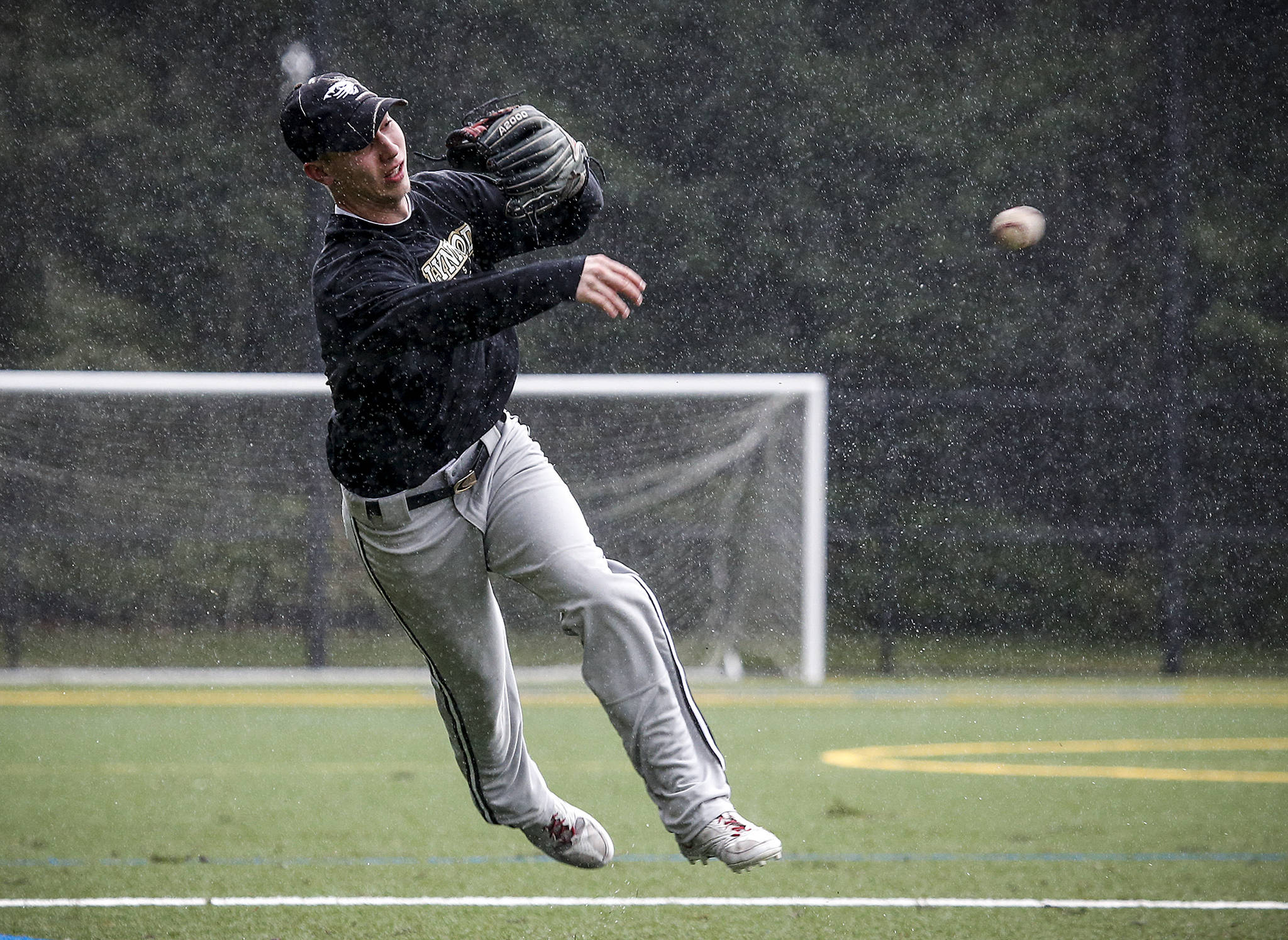 Lynnwood shortstop Kyler McMahan makes an on-the-run throw to first base during a team practice at Scriber Lake High School on March 14, 2017. McMahan is an Oregon State University signee and was recently listed as one of the country’s top 100 high school baseball prospects. (Ian Terry / The Herald)