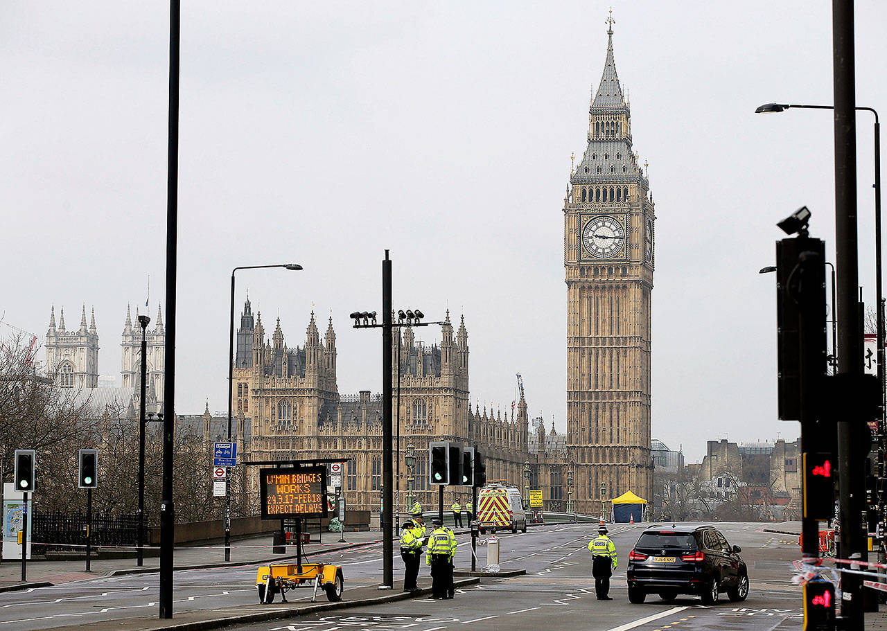 Police work at Westminster Bridge, with the Houses of Parliament in background, in London on Thursday. (AP Photo/Tim Ireland)
