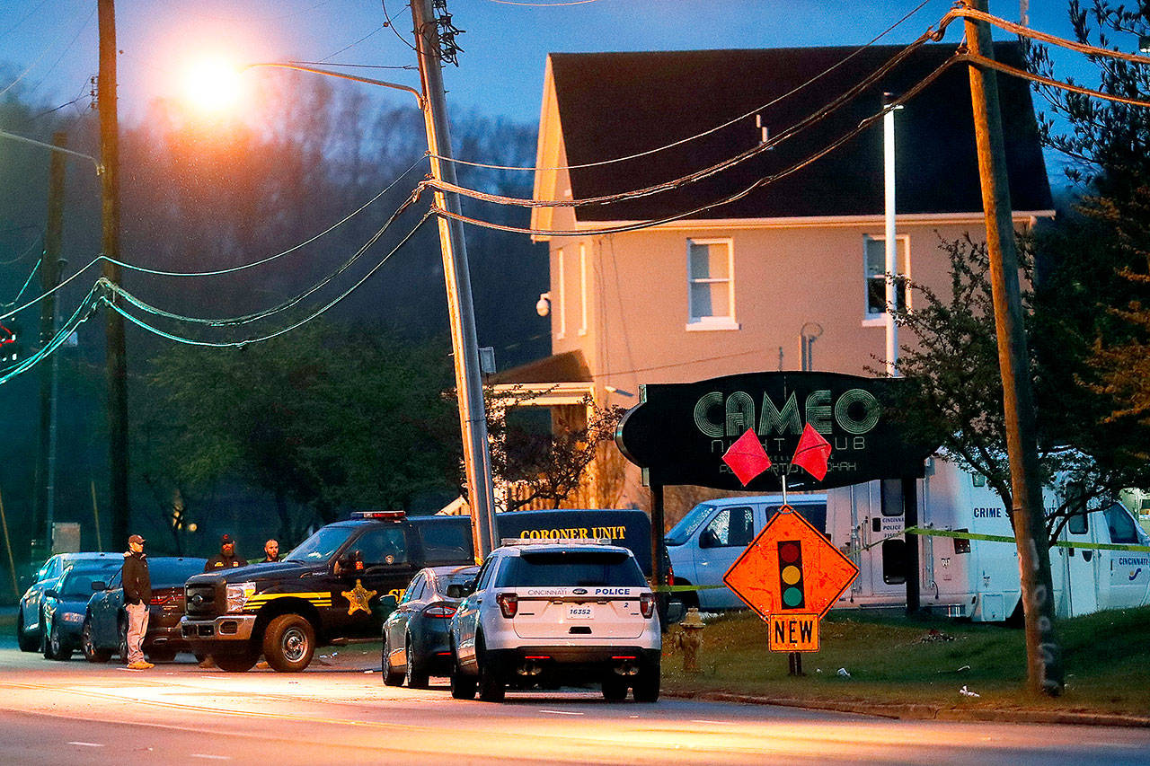 Police work at a crime scene outside the Cameo club after a fatal shooting on Sunday in Cincinnati. (AP Photo/John Minchillo)