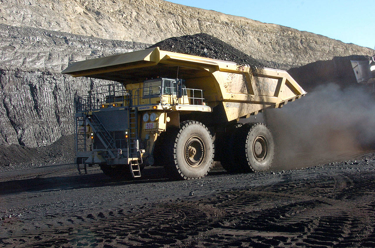 A 250-ton capacity truck carries coal from the Spring Creek strip mine near Decker, Montana, in 2016. (AP Photo/Matthew Brown, File)