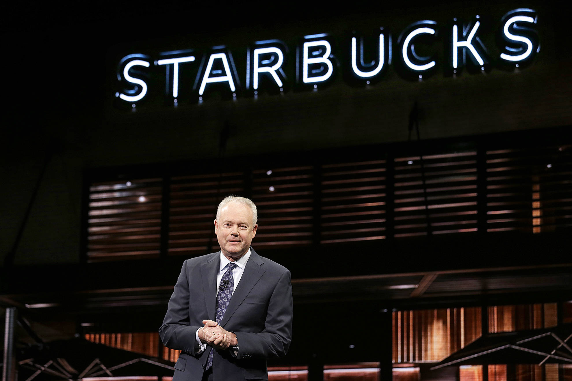 Kevin Johnson speaks at Starbucks annual shareholders meeting March 22 in Seattle. (AP Photo/Elaine Thompson)