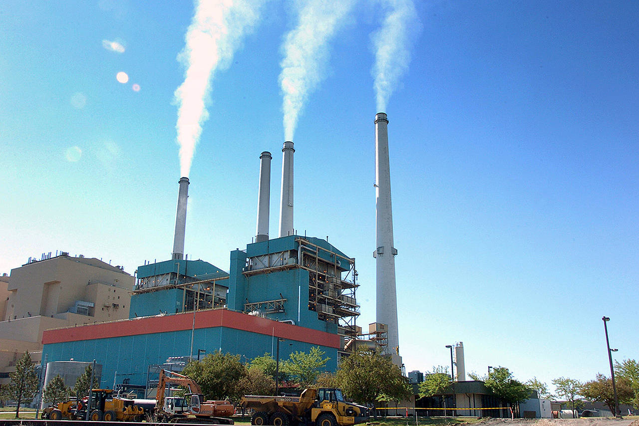 In this 2013 photo, smoke rises from the Colstrip Steam Electric Station, a coal burning power plant in Colstrip, Montana. (AP Photo/Matthew Brown, File)