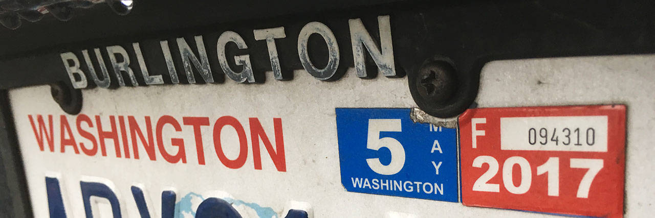 Washington car owners have been howling at car tab bills that are double or triple from a year ago. (Sue Misao / The Herald)