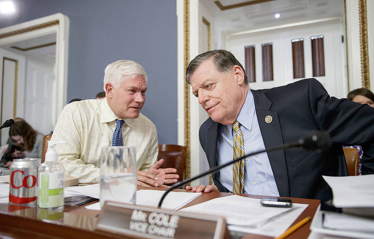 House Rules Committee Chairman Rep. Pete Sessions, R-Texas, (left) and vice chair Rep. Tom Cole, R-Okla., confer Wednesday as the panel shapes the final version of the Republican health care bill. (AP Photo/J. Scott Applewhite)