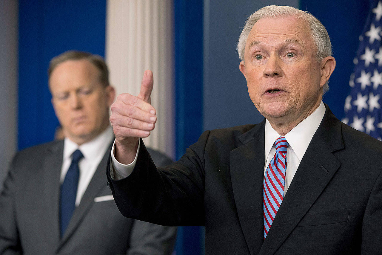 Andrew Harnik / associated press                                 Attorney General Jeff Sessions (right), accompanied by White House press secretary Sean Spicer, talks to the media during the daily press briefing at the White House on Monday.