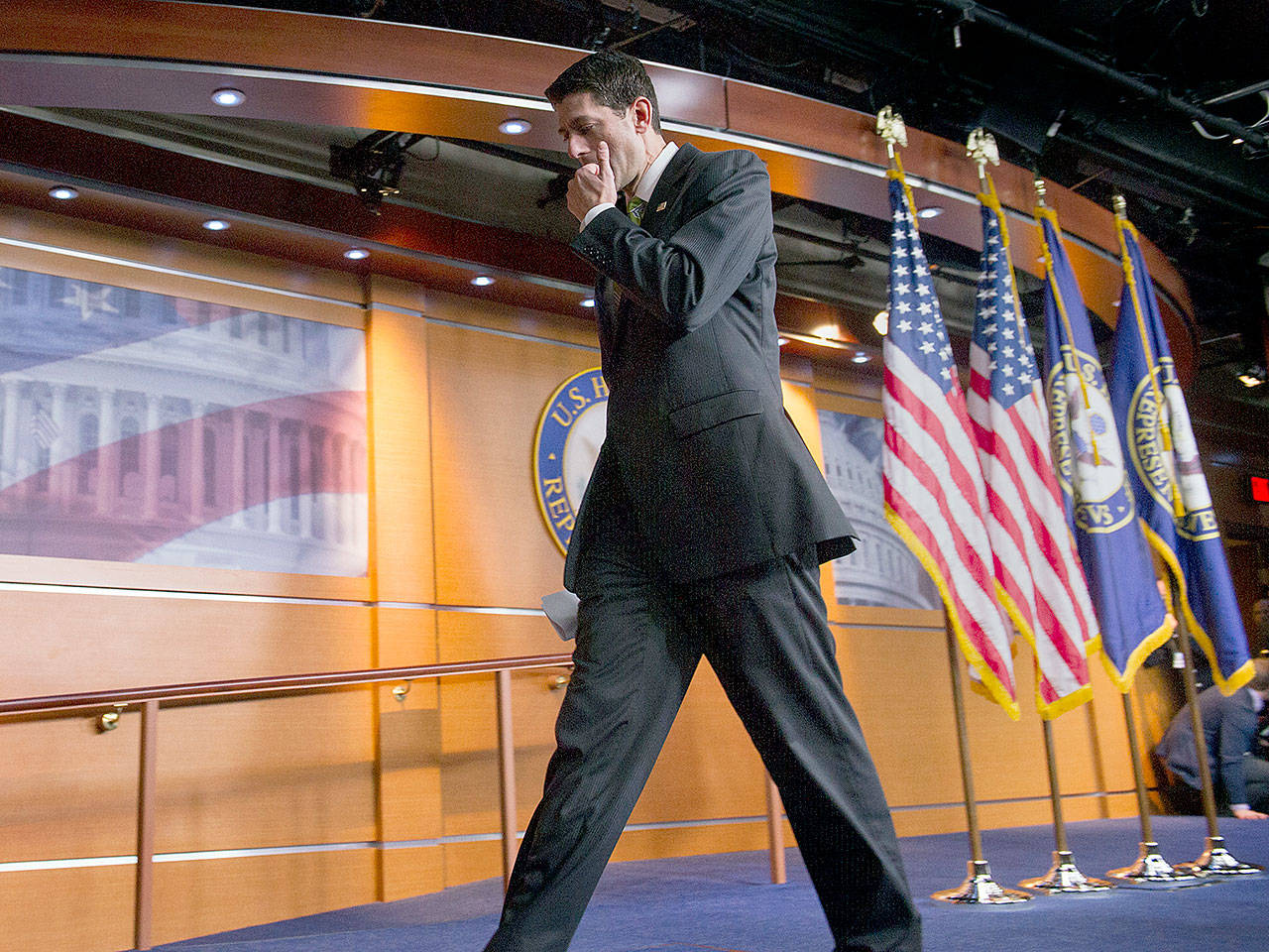 House Speaker Paul Ryan of Wisconsin walks away from the microphones on Friday after telling the news media that there would be no vote on the health care overhaul bill. (AP Photo/Cliff Owen)
