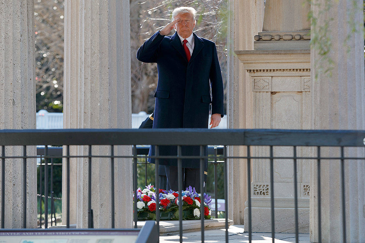 President Donald Trump salutes after laying a wreath at the Hermitage, the home of President Andrew Jackson, to commemorate Jackson’s 250th birthday on Wednesday in Nashville, Tennessee. (AP Photo/Evan Vucci)