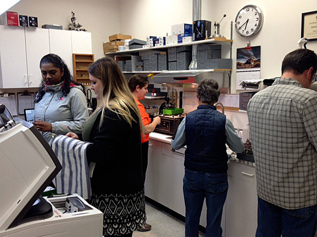 Key Club and Kiwanis volunteers wash and dry donated eyeglasses for shipment to the Philippines, Mexico and Africa. (Contributed photo)