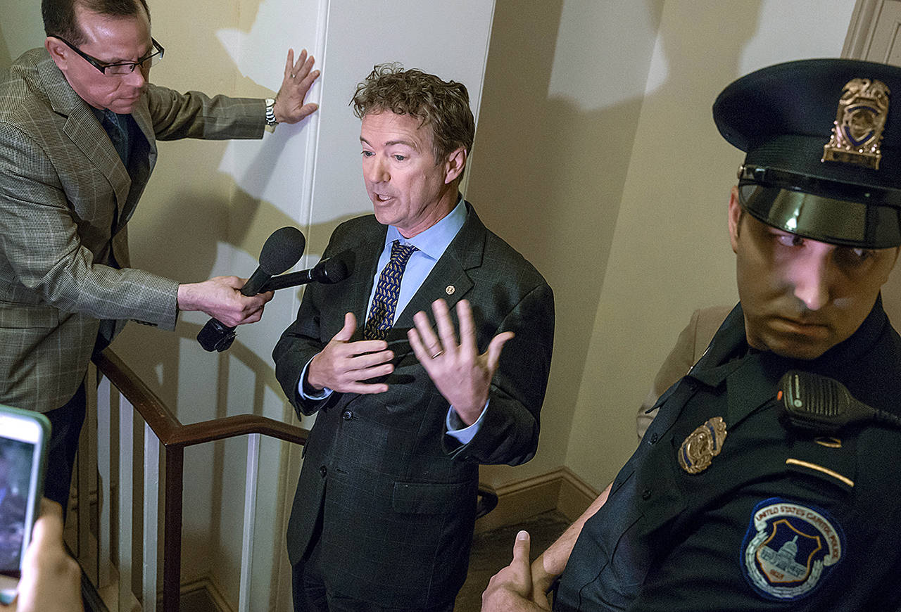 Sen. Rand Paul, R-Ky., holds an impromptu news conference outside a room on Capitol Hill in Washington on Thursday, March 2, where he charges House Republicans are keeping their Obamacare repeal and replace legislation under lock and key and not available for public view. (AP Photo/J. Scott Applewhite)