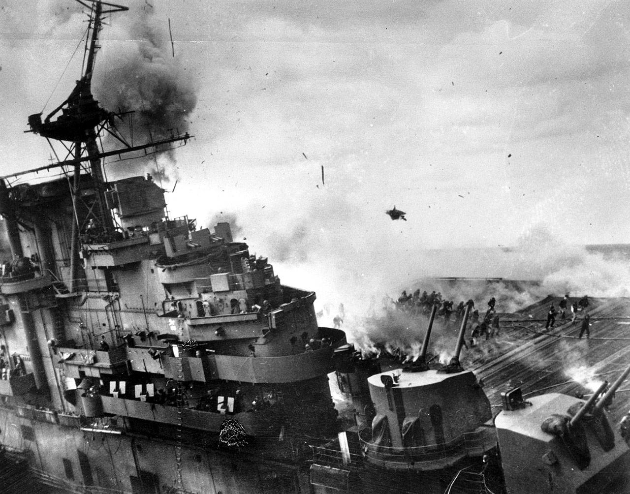 An explosion rocks the USS Franklin after the warship was hit by two 500 pound armor-piercing bombs from a Japanese dive bomber on March 19, 1945, off the coast of Honshu, during the Okinawa invasion. The attack killed 724 people, but the ship was saved. (Associated Press photo)