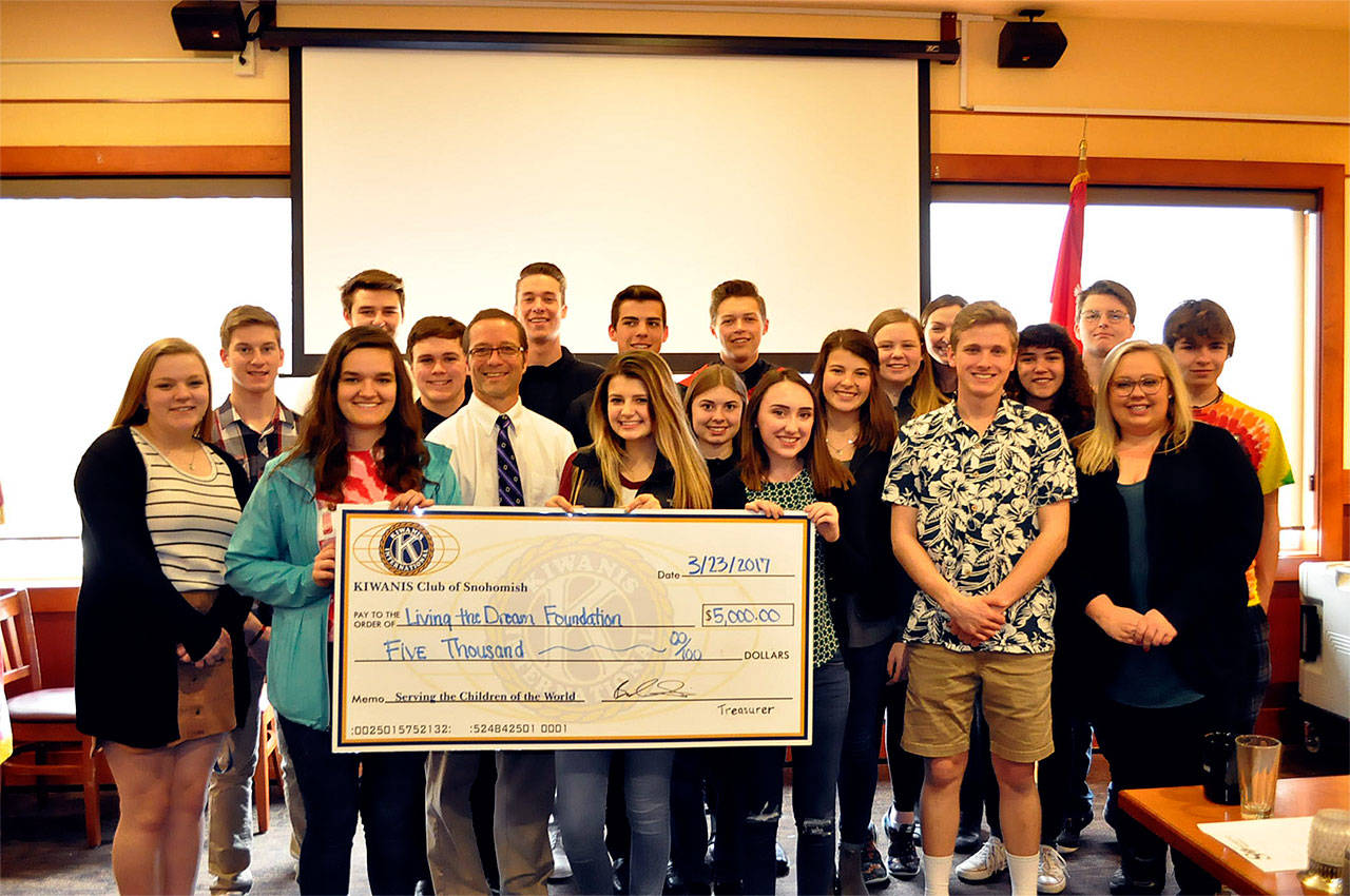 Snohomish High School students accept a $5,000 donation from the Snohomish Kiwanis Club for a Fight Against Hunger fundraiser. (Contributed photo)