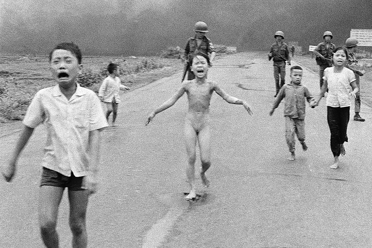 In this June 8, 1972, photo taken by Huynh Cong “Nick” Ut, South Vietnamese forces follow terrified children, including 9-year-old Kim Phuc (center) as they run down Route 1 near Trang Bang after an aerial napalm attack on suspected Viet Cong hiding places. After making the photo, he set aside his camera, gave the badly burned girl water, poured more on her wounds, then loaded her and others into his Associated Press van to take them to a hospital. When doctors refused to admit her, saying she was too badly burned to be saved, he angrily flashed his press pass. The next day, he told them, pictures of her would be displayed all over the world, along with an explanation of how the hospital refused to help. (AP Photo/Nick Ut, File)
