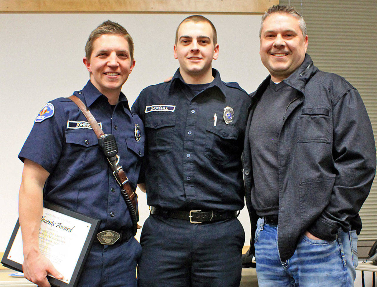 North County paramedic Eric Johnson (from left) and firefighter Blake Churchill were honored with the Marysville Fire District’s Phoenix Award for helping to save the life of Marysville Fire District paramedic Kevin Johnson. North County firefighter Patrick Fournier (not pictured) also was honored. (Contributed photo)