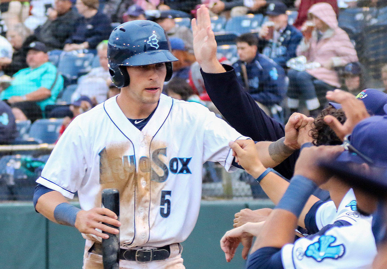 Drew Jackson makes his way to the dugout after the scoring for the AquaSox during a game against the Emeralds on June 18, 2015 in Everett. (Kevin Clark / The Herald)