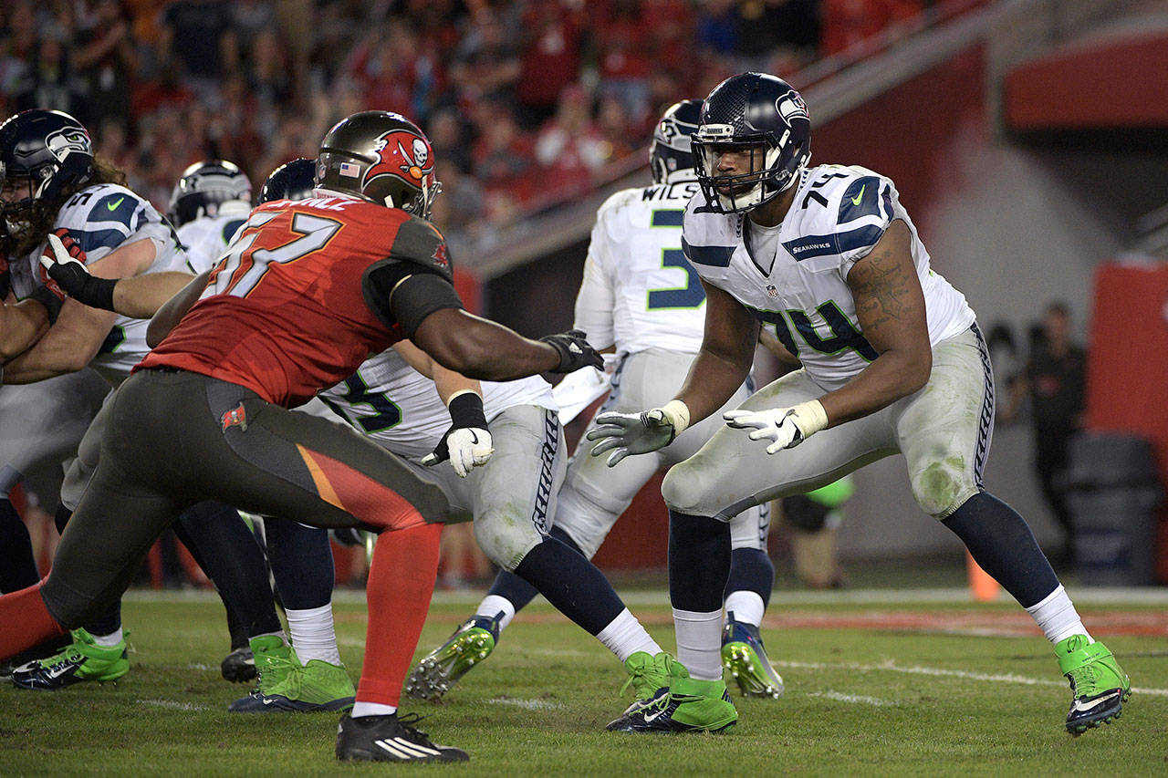 Seahawks offensive tackle George Fant (74) sets up to block against Buccaneers defensive end Noah Spence (57) during the second half of a game Nov. 27, 2016, in Tampa, Fla. (AP Photo/Phelan M. Ebenhack)