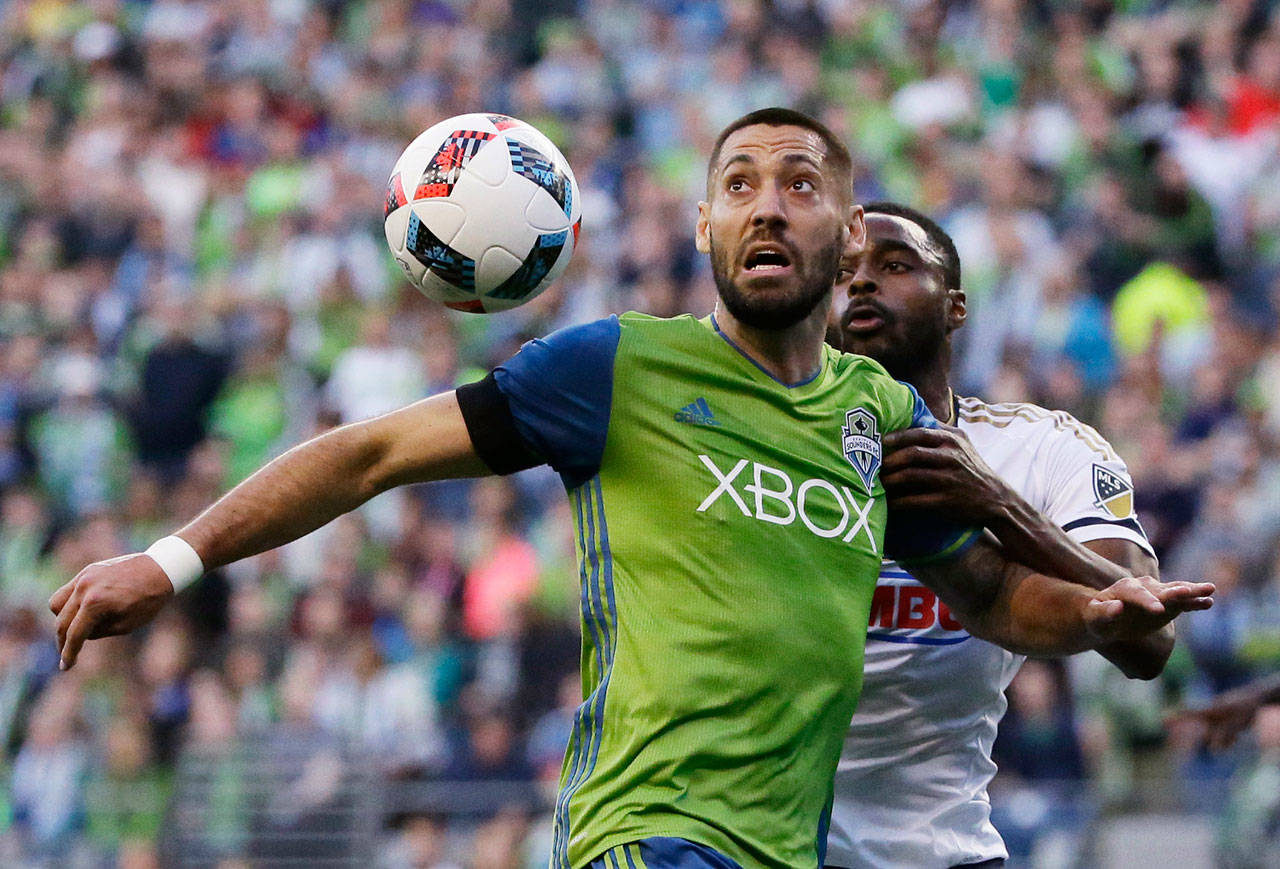 Sounders forward Clint Dempsey (left) and Union’s Warren Creavalle eye the ball during an MLS match on Aug. 16, 2016, in Seattle. (Ted S. Warren / Associated Press)
