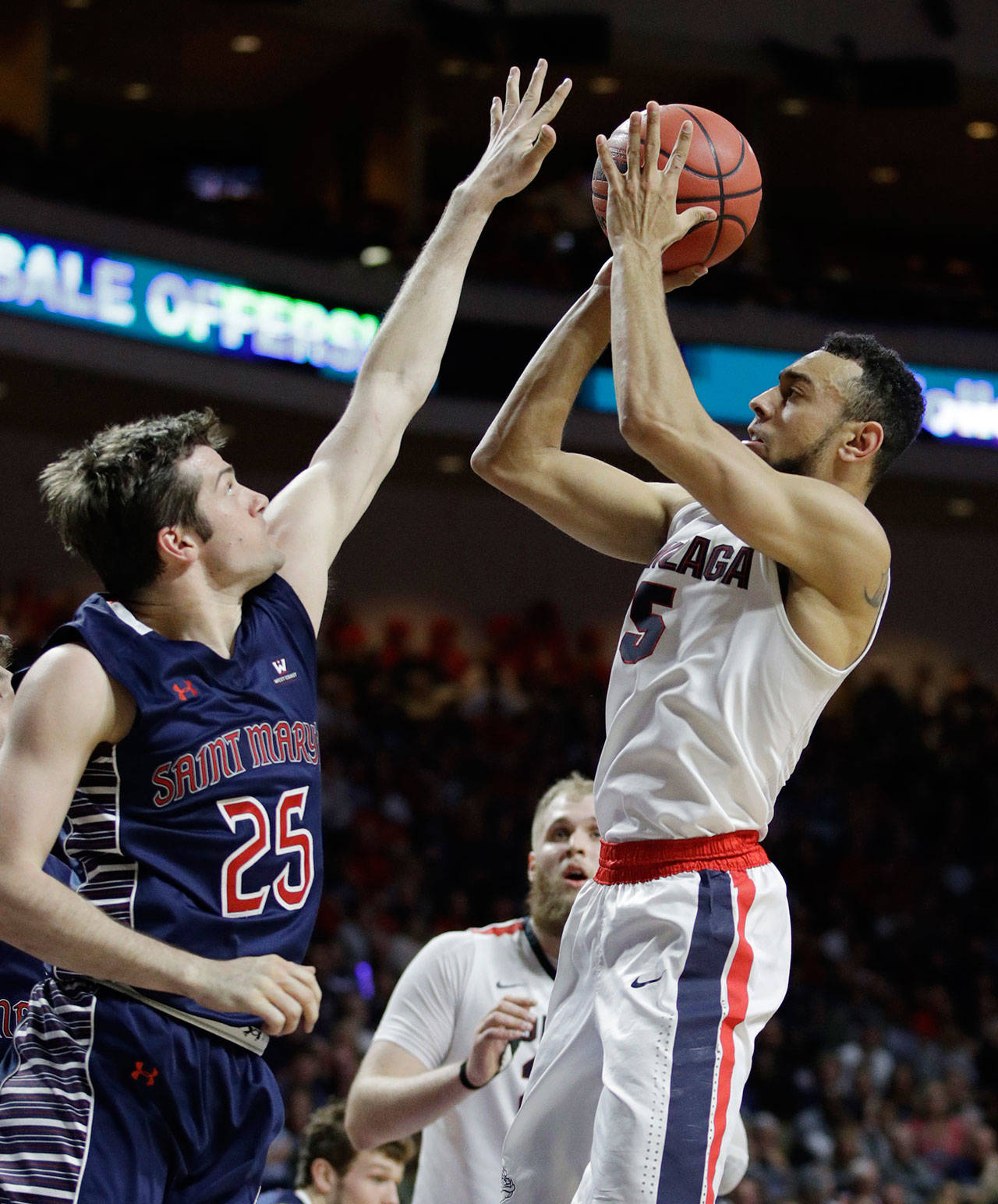 Gonzaga’s Nigel Williams-Goss shoots over Saint Mary’s Joe Rahon in the first half of the championship of the West Coast Conference tournament on March 7, 2017, in Las Vegas. (AP Photo/John Locher)