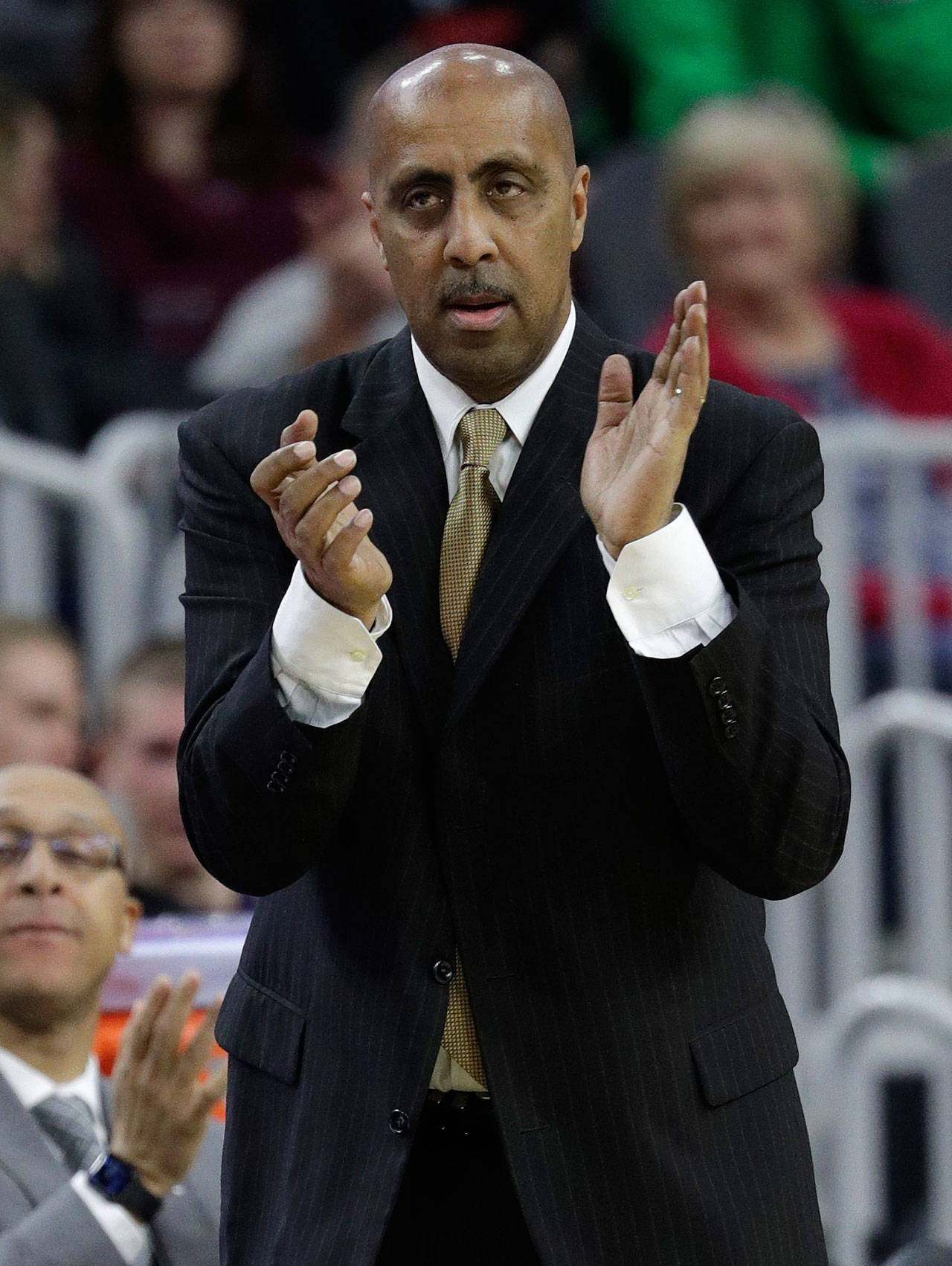 Washington head coach Lorenzo Romar reacts after a play against Southern California during the second half of a game in the first round of the Pac-12 men’s tournament March 8, 2017, in Las Vegas. (AP Photo/John Locher)