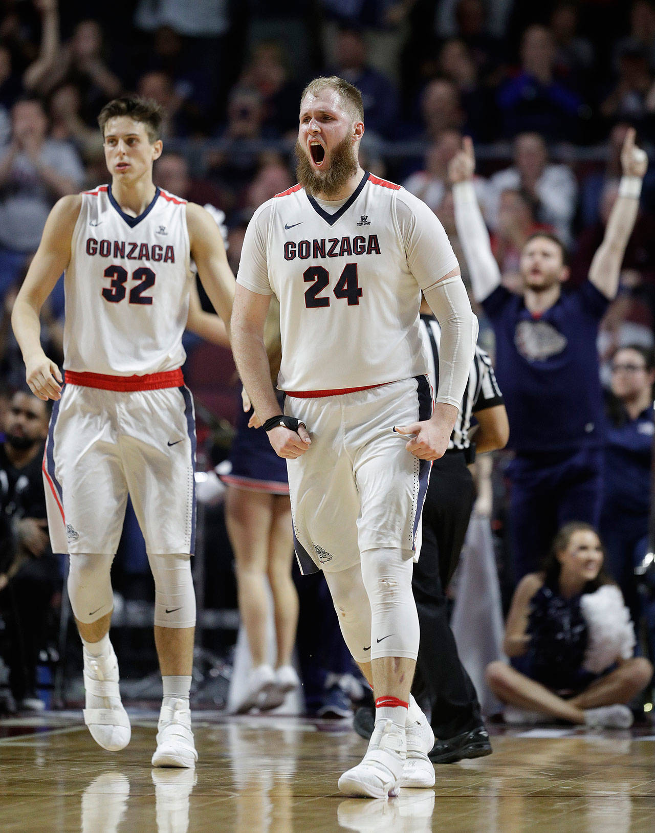 Gonzaga’s Przemek Karnowski (24) celebrates after scoring against Saint Mary’s in the second half of the championship of the West Coast Conference tournament on March 7, 2017, in Las Vegas. Gonzaga won 74-56. (AP Photo/John Locher)