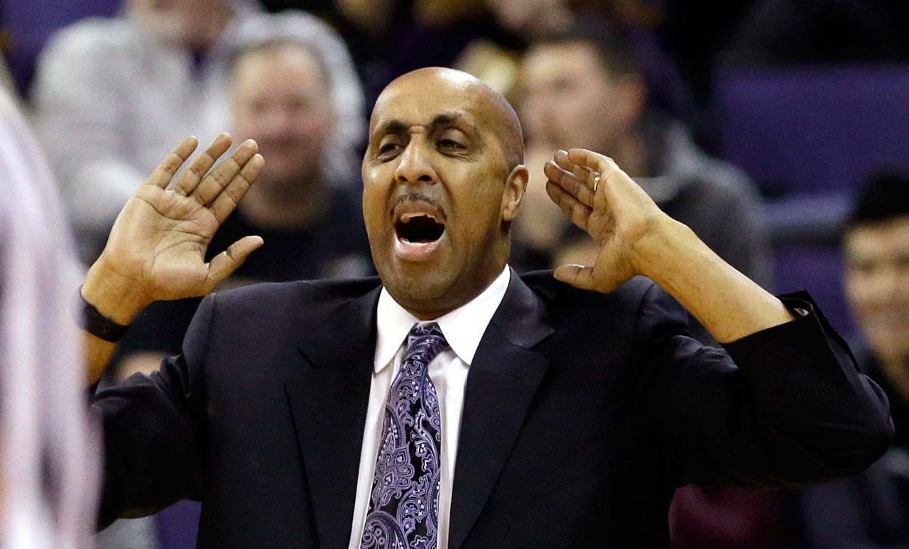 Washington head coach Lorenzo Romar directs his team against Southern California during a game Feb. 1, 2017, in Seattle. (AP Photo/Elaine Thompson)