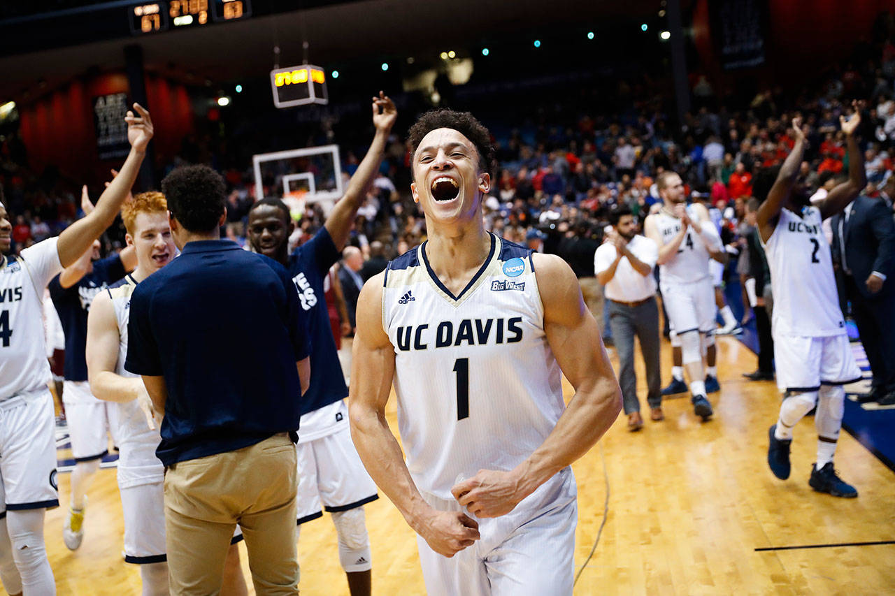 UC Davis’ Lawrence White (1) celebrates after beating North Carolina Central 67-63 in a First Four game of the NCAA tournament on March 15, 2017, in Dayton, Ohio. (AP Photo/John Minchillo)