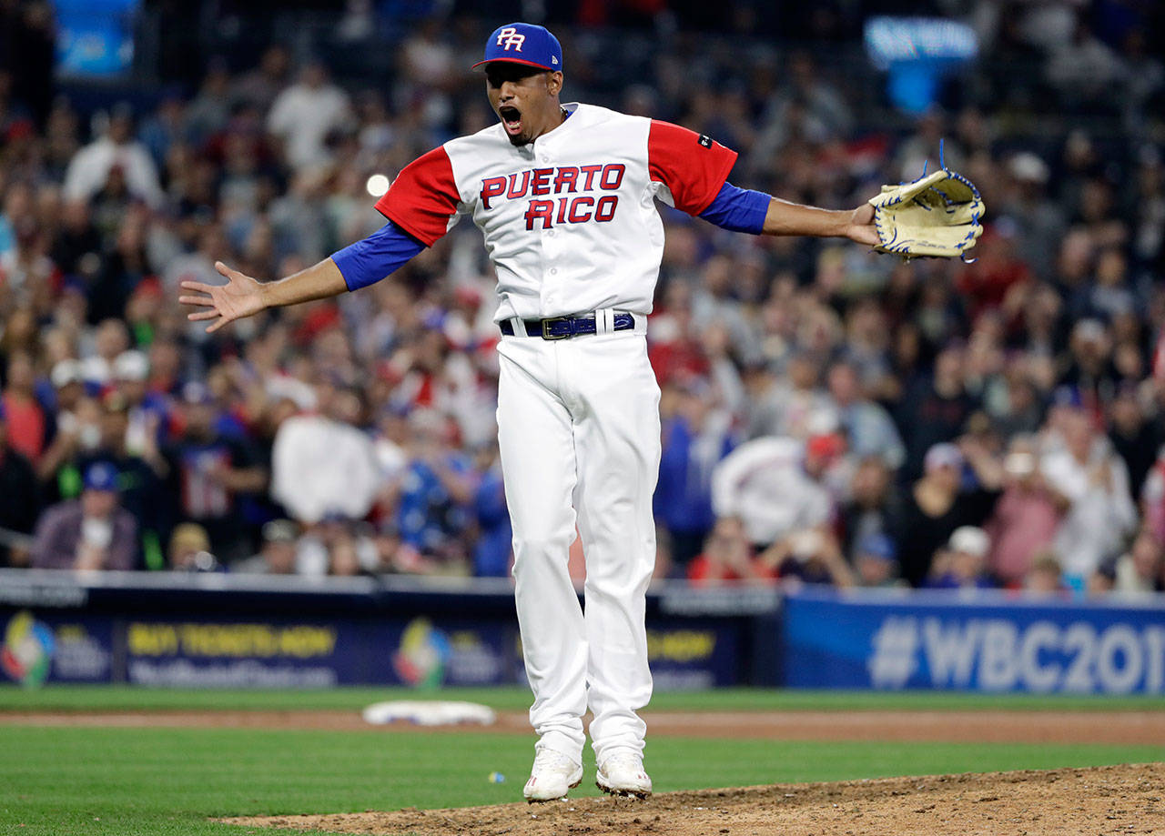 Puerto Rico pitcher Edwin Diaz reacts after getting the last out to defeat the Dominican Republic in a second-round World Baseball Classic game March 14, 2017, in San Diego. (AP Photo/Gregory Bull)