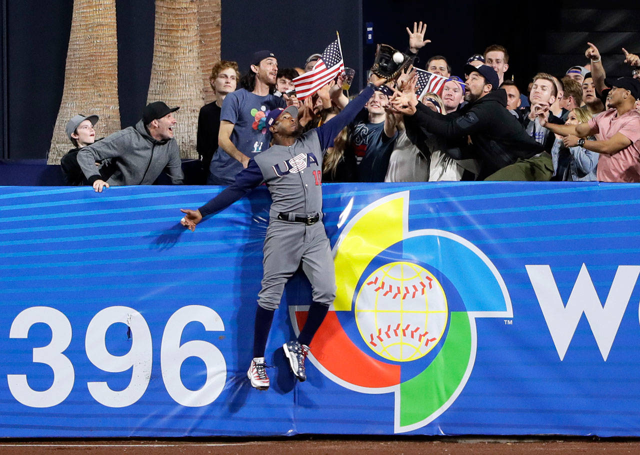 U.S. outfielder Adam Jones robs a home run from the Dominican Republic’s Manny Machado during the seventh inning of a World Baseball Classic game on March 18, 2017, in San Diego. (AP Photo/Gregory Bull)