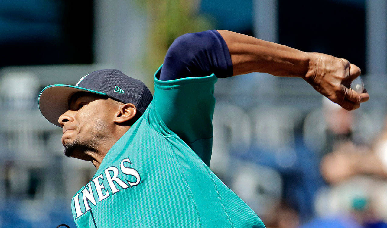 Mariners starting pitcher Ariel Miranda throws during the first inning of a spring training game against the Brewers on March 2, 2017, in Peoria, Ariz. (AP Photo/Charlie Riedel)