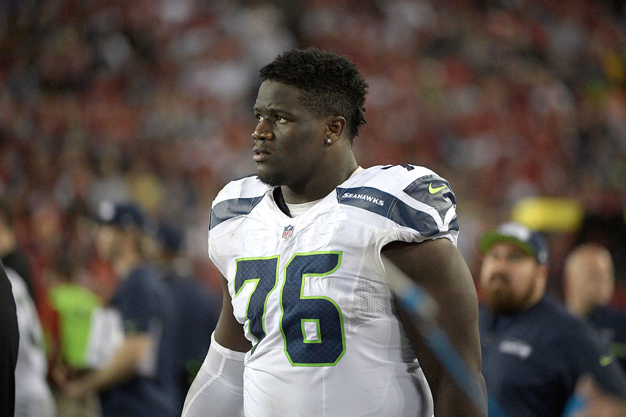 Seahawks offensive guard Germain Ifedi (76) watches from the sideline during the second half of a game against the Buccaneers on Nov. 27, 2016, in Tampa, Fla. (AP Photo/Phelan M. Ebenhack)