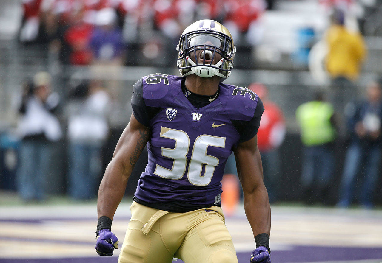 Washington’s Azeem Victor reacts to a play during a game against Rutgers on Sept. 3, 2016, in Seattle. (Elaine Thompson / Associated Press)
