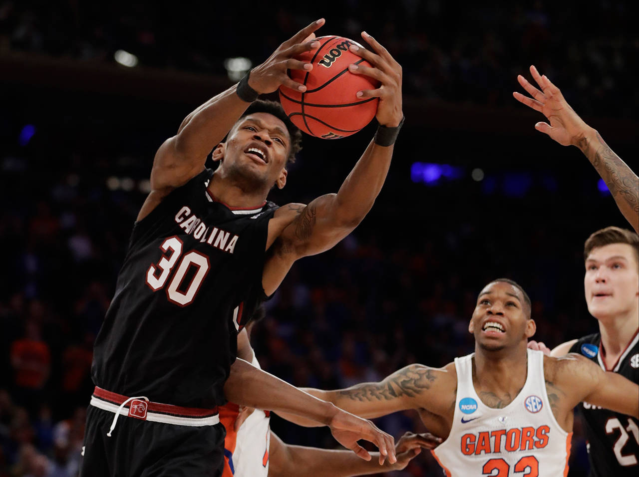 South Carolina forward Chris Silva (30) grabs a rebound against Florida during the second half of the East Regional championship game of the NCAA men’s college basketball tournament, Sunday, March 26, in New York. (AP Photo/Julio Cortez)