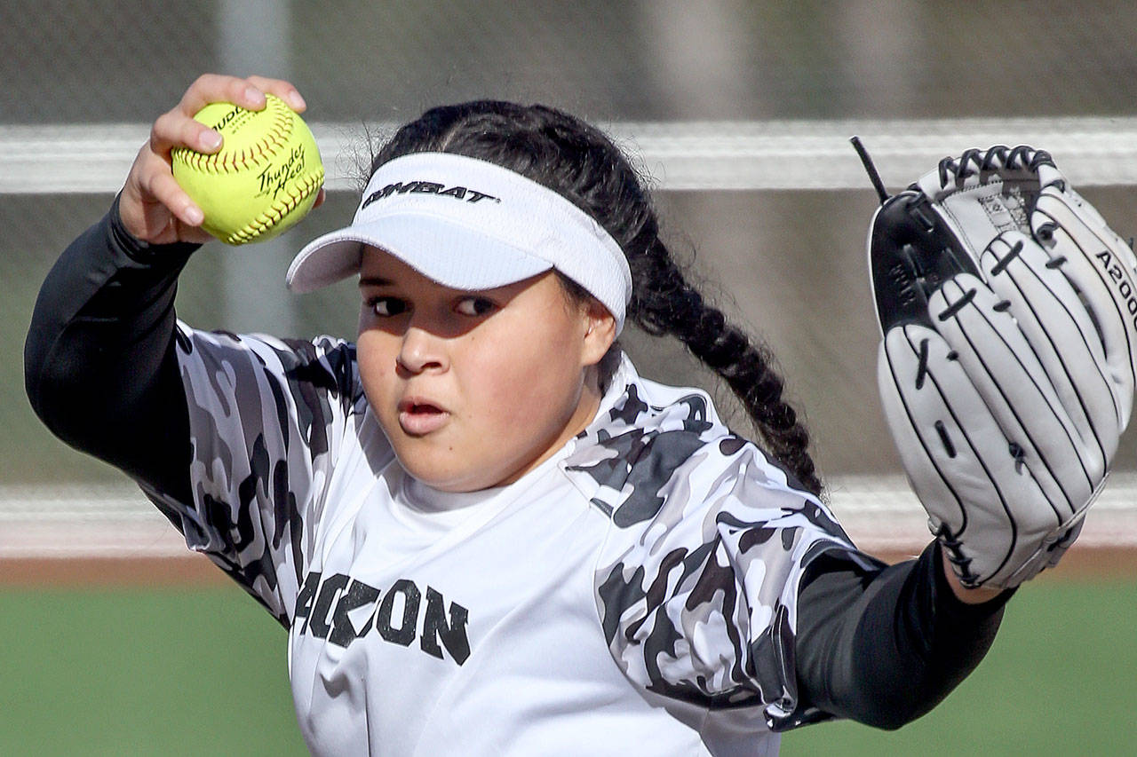 Jackson’s Iyanla Pennington winds up for a pitch during a game against Snohomish on March 16, 2017, at Valley View Middle School in Snohomish. Jackson won 3-1. (Kevin Clark / The Herald)