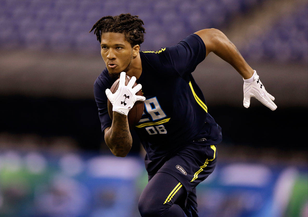 Washington defensive back Sidney Jones runs during the NFL scouting combine on March 6, in Indianapolis. (AP Photo/Michael Conroy)