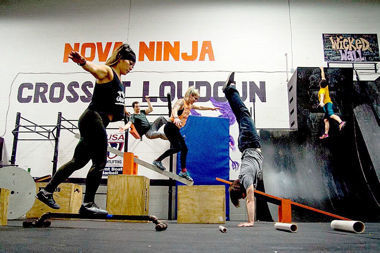 Janice ‘JJ’ McClean, left, co-owns CrossFit Loudoun and Northern Virginia Ninja, which offers obstacle course racing inspired by television’s ‘Ninja’ competitions. (Courtesy photo / Northern Virginia Ninja)