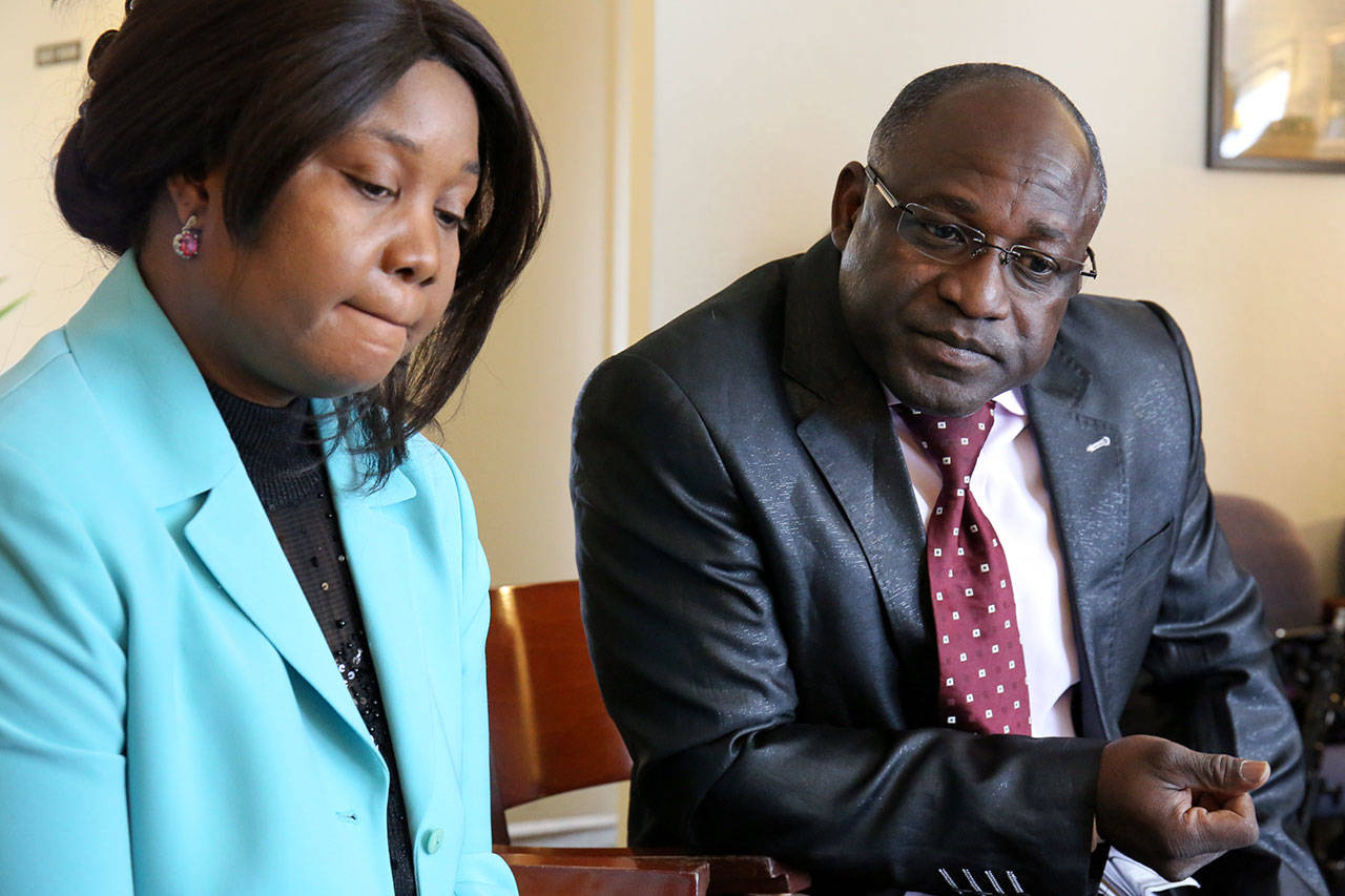 Parents of Ben Keita, Aissata and Ibrahima Keita, address the media at the law offices of Nur Law in Everett on Wednesday. Ben Keita was found dead in January and the family is looking for answers. (Kevin Clark / The Herald)