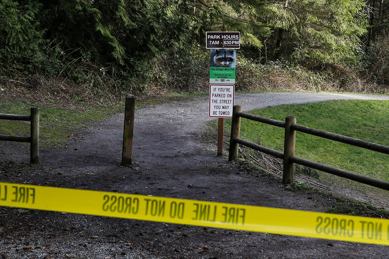 Police tape marks the closure of a trail at Meadowdale Beach Park near Lynnwood after a tree fell on and killed a teenage girl on Friday. (Ian Terry / The Herald)