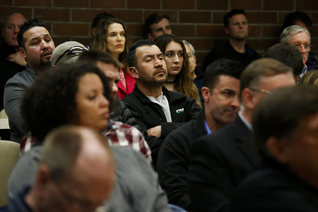A meeting room at Fire District 1 in Everett is filled during a public comment period to address concerns regarding racist statements made by Commissioners David Chan and Bob Meador at a meeting on March 7. (Ian Terry / The Herald)
