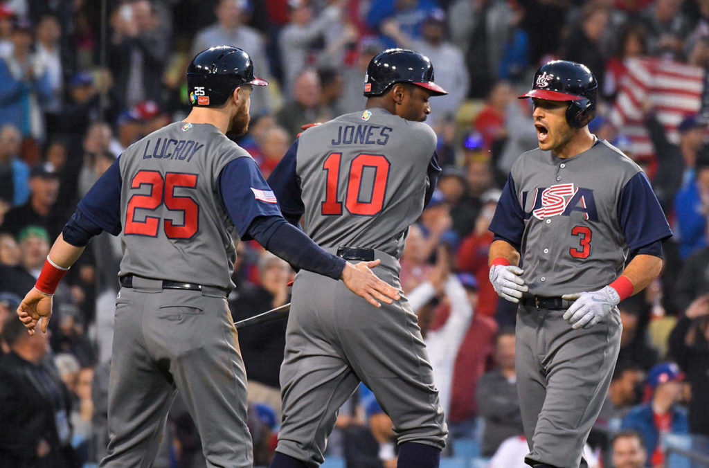 The United States’ Ian Kinsler (right) celebrates his two-run home run with Jonathan Lucroy (left) and Adam Jones during the third inning against Puerto Rico in the final of the World Baseball Classic on March 22, 2017, in Los Angeles. (AP Photo/Mark J. Terrill)
