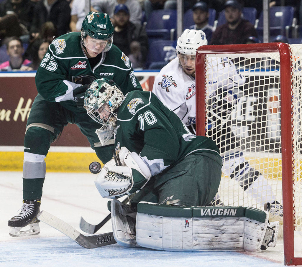 The Silvertips’ Carter Hart makes a save in front of teammate Jake Christiansen (top left) and the Royals’ Ethan Price in a playoff game march 28, 2017, at the Save-on-Foods Centre in Victoria, B.C. (Darren Stone / Times Colonist)
