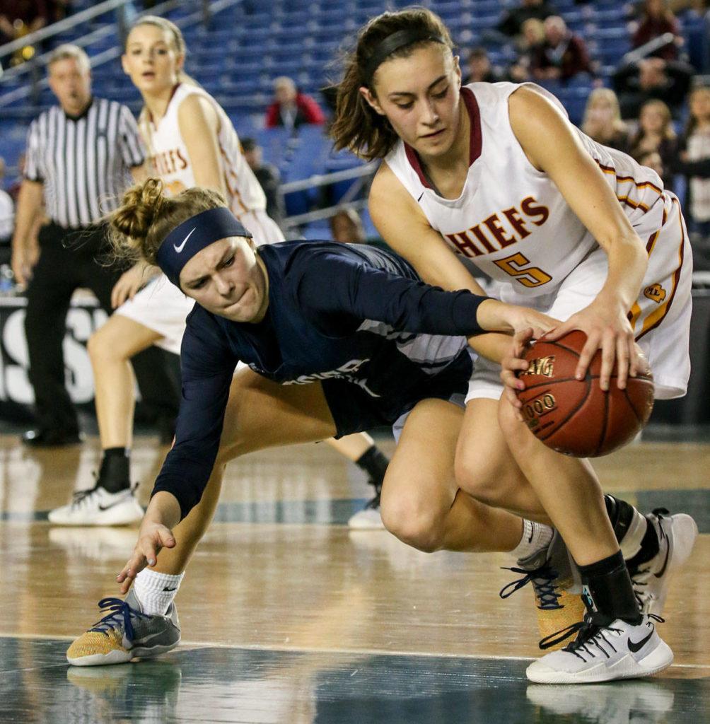 Glacier Peak’s Paisley Johnson tries to steal the ball away from Moses Lake’s Jamie Loera during a 4A state tournament semifinal game on March 3, 2017, at the Tacoma Dome. Glacier Peak won 55-51 to advance to the state finals. (Kevin Clark / The Herald)

