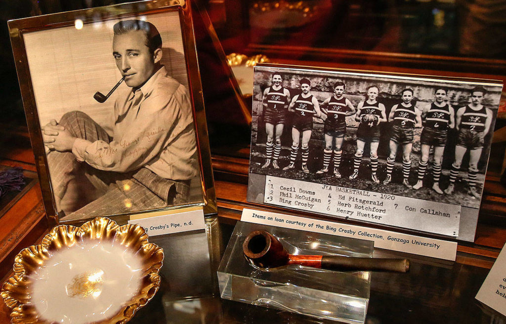 A Bing Crosby display, including his youth basketball photo and pipe, is among the historical items on view at Spokane’s famed Davenport Hotel. The singer-actor lived near Gonzaga University as a boy and later studied law there. (Dan Bates / The Herald)
