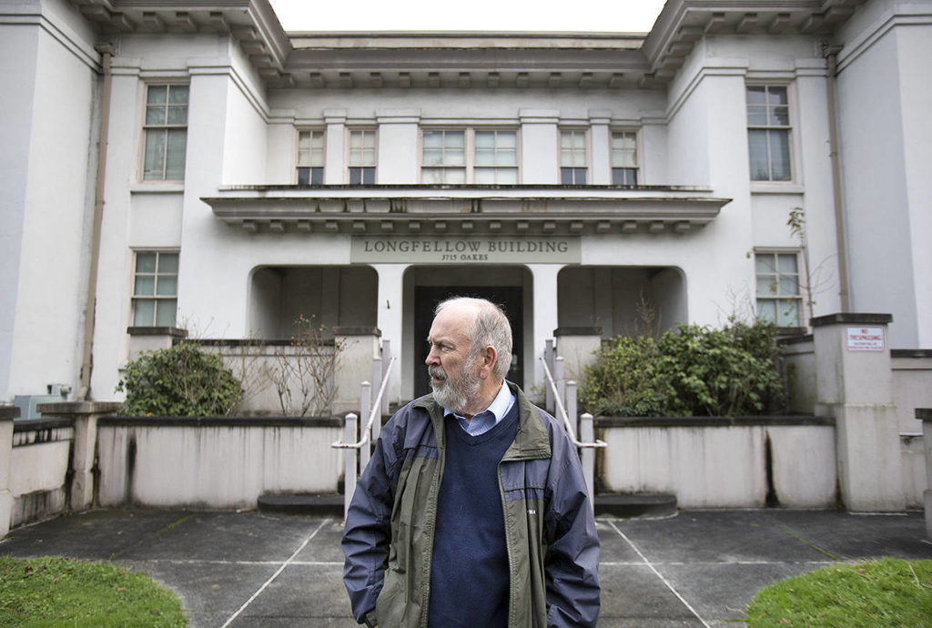 Jack O’Donnell, chairman of the Everett Historical Commission, stands in front of the Longfellow building in December. (Andy Bronson / Herald file)
