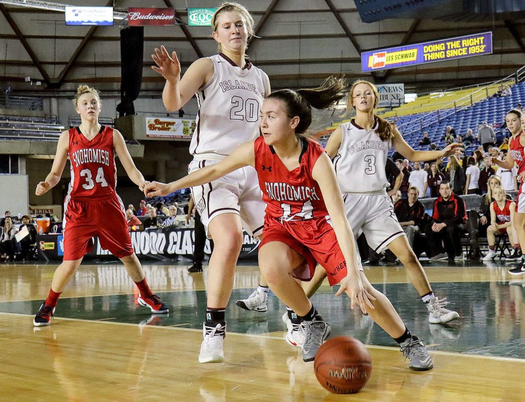 Snohomish’s Emily Preach dribbles the ball with Mercer Island’s Anna Luce defending a 3A Hardwood Classic semifinal game Friday at the Tacoma Dome. Snohomish lost to Mercer Island 60-51. (Kevin Clark / The Herald)
