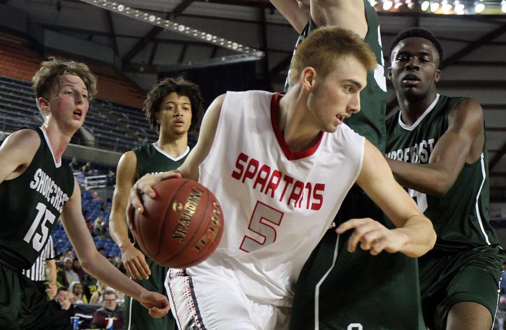 Stanwood’s Chase Strieby attempts to get around Shorecrest’s defense during a 3A Hardwood Classic tournament game March 1 at the Tacoma Dome. Stanwood defeated Shorecrest 64-52. (Kevin Clark / The Herald)

