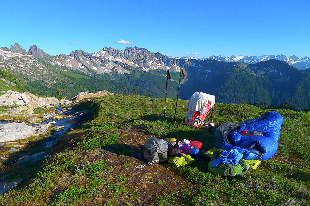 Photos courtesy Mike Woodmansee                                Woodmansee sets up camp in the Glacier Peak Wilderness.