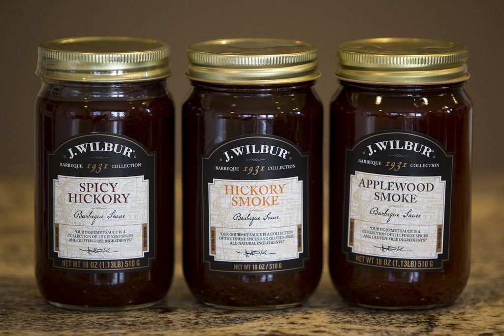 J. Wilbur Food’s barbecue sauce varieties (from left) Spicy Hickory, Hickory Smoke and Applewood Smoke. (Ian Terry / The Herald)
