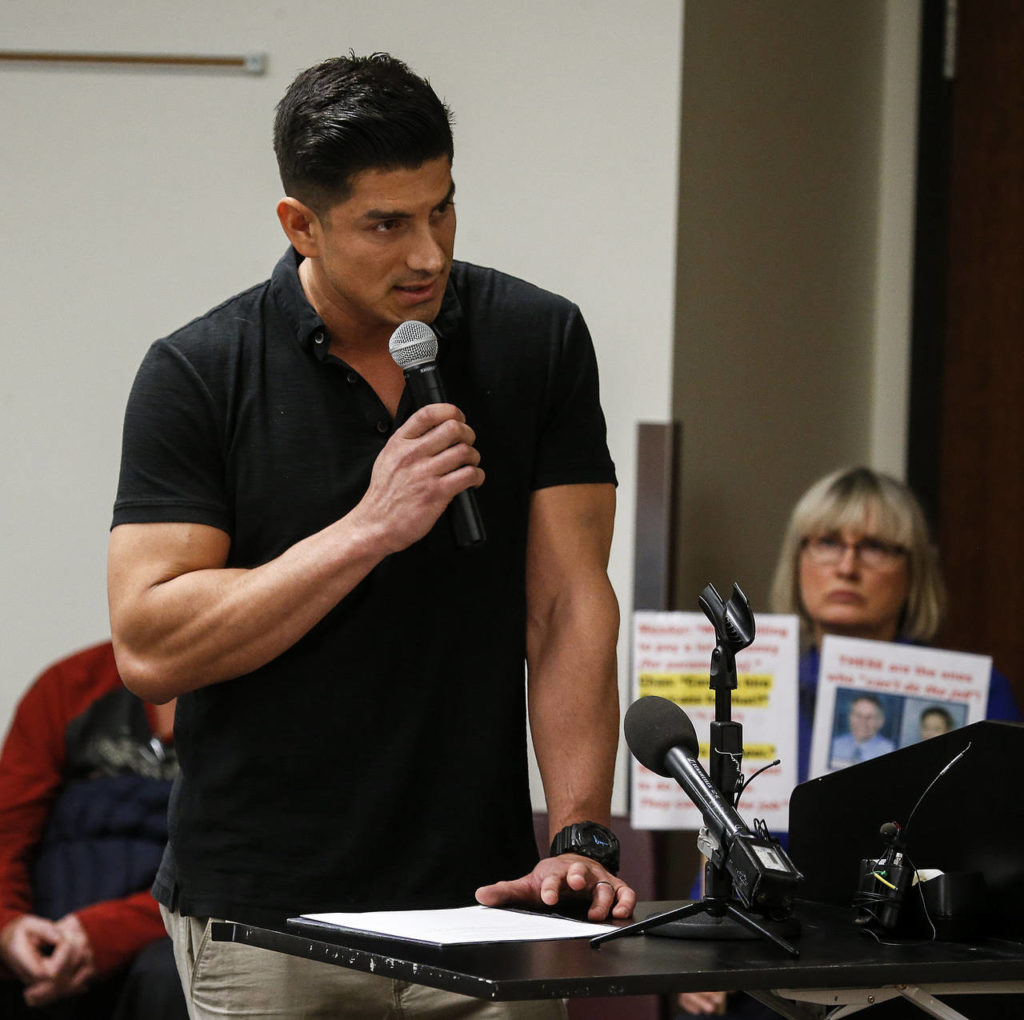 Snohomish County District 1 firefighter Moi Castellon addresses the commission. (Ian Terry / The Herald)
