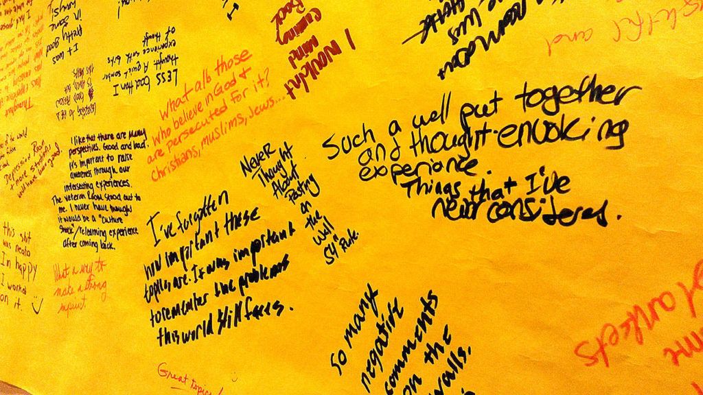 Viewers of the Tunnel of Intersections exhibit at Edmonds Community College Wednesday wrote their reactions on paper signs that display planners called a graffiti space. The exhibit, meant to highlight oppression, features the experiences of diverse groups. (Courtesy Edmonds Community College)

