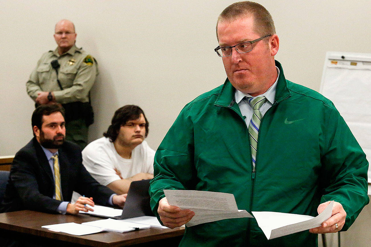 At the sentencing for Anthony Box (sitting, right) on Thursday, Corby Whiddon turns from the bench after testifying about the death of his 17-year-old daughter, Madison. She was killed in a 2015 accident while a passenger in a car driven by Box. Sitting at left is Box’s attorney, Gabriel Rothstein. (Dan Bates / The Herald)