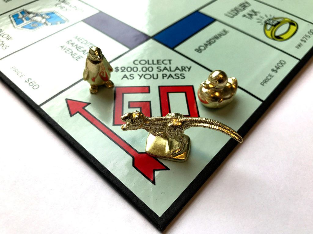 Fans of the game Monopoly voted to replace three of the eight tokens in 2017. The new tokens are, from left, a penguin, a T. rex and a duck. Beginning in August, new games will feature the pieces, which will be silver-colored to match the others. (Marvin Joseph / Washington Post)
